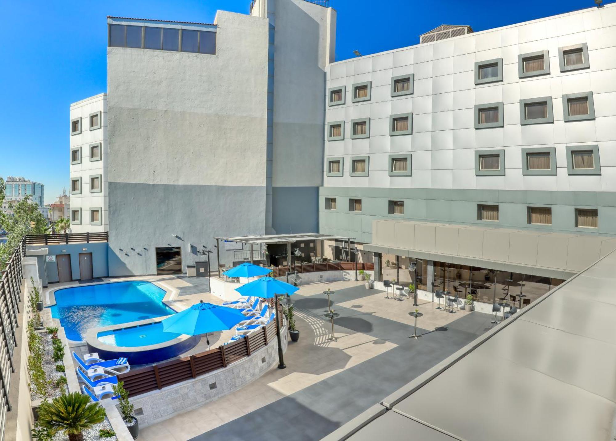 Geneva Hotel Аман Екстериор снимка